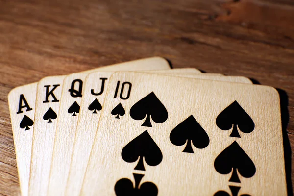 Playing cards on wooden table, closeup — Stock Photo, Image