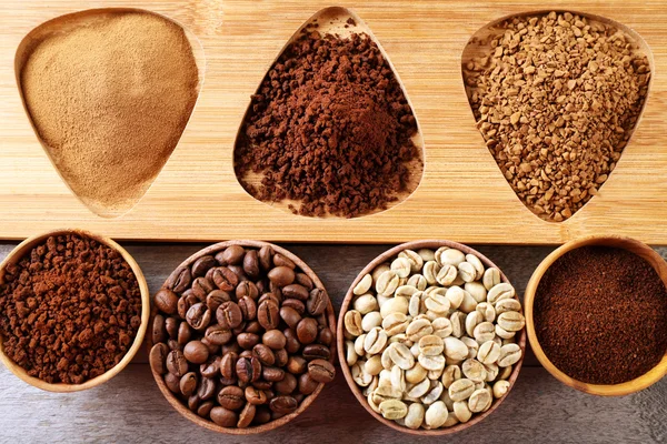 Various of coffee in small dishes on wooden table, top view — Stock Photo, Image