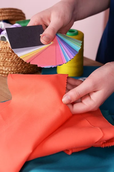 Samples of colorful fabric in female hands, closeup — Stock Photo, Image