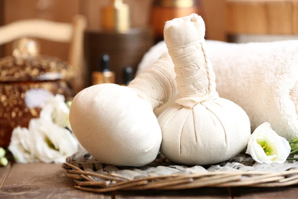 Beautiful spa composition with massage bags on table close up — Stock Photo, Image