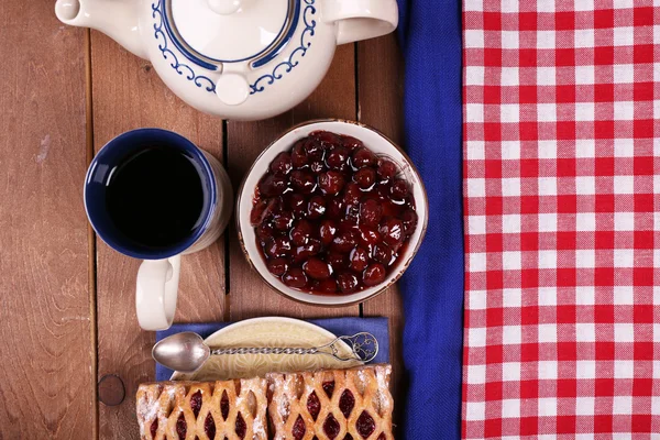 Baking, tea and jam on wooden table top view — Stock Photo, Image