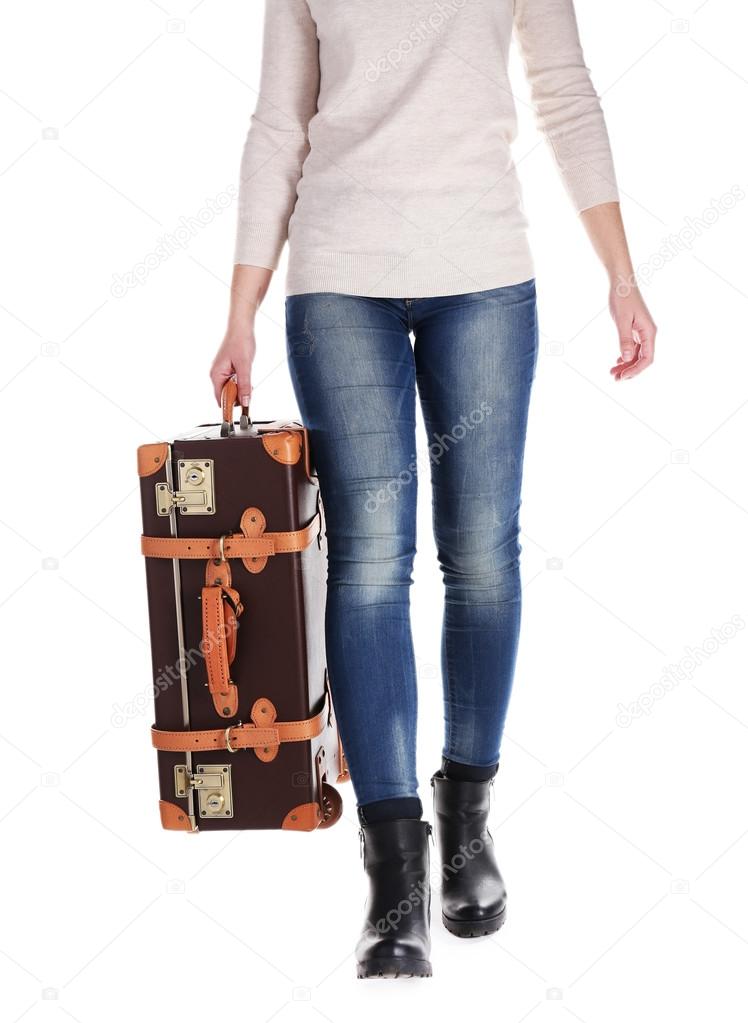 Woman with suitcase isolated on white