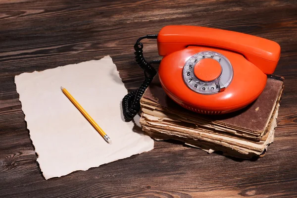 Retro red telephone on table close-up — Stock Photo, Image