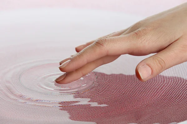 Finger touches water — Stock Photo, Image