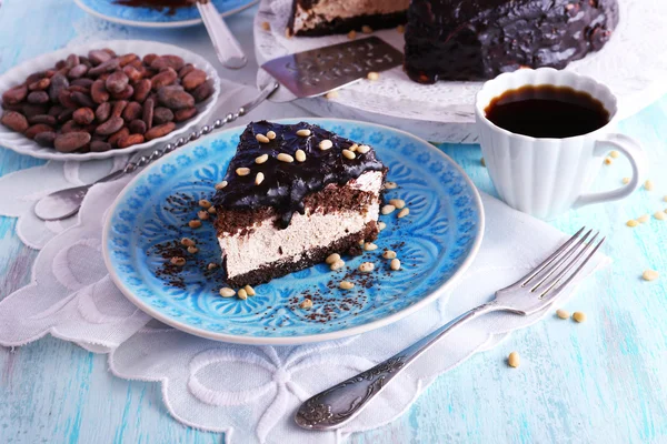 Delicious chocolate cake with icing in plate on table, closeup — Stock Photo, Image