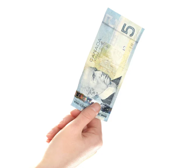 Γυναικείο χέρι με το καναδικό δολάριο 5, απομονωμένα σε λευκό — Φωτογραφία Αρχείου