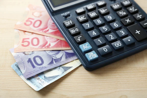 Calculator and Canadian dollars — Stock Photo, Image