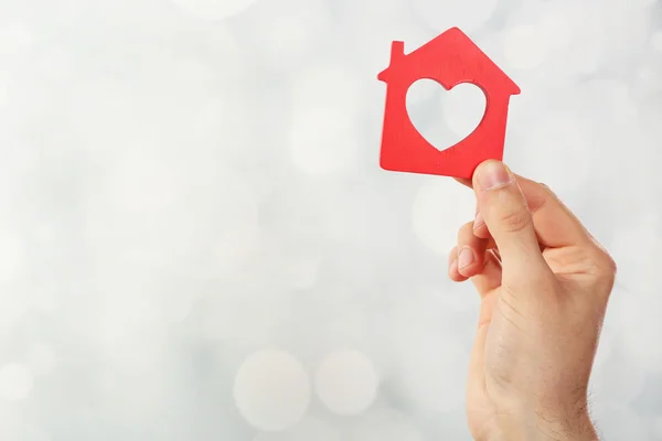 Female hand holding house — Stock Photo, Image