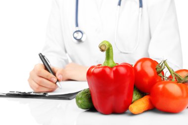 Nutritionist Doctor writing diet plan clipart