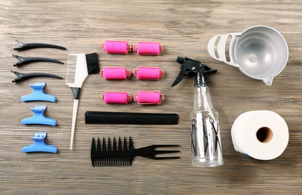 Hairdressing tools on wooden background — Stock Photo, Image