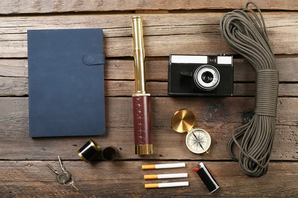 Hiking gear on wooden background — Stock Photo, Image