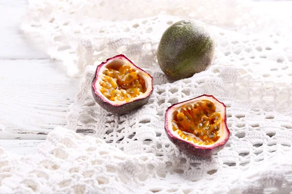 Passion fruits on color wooden background — Stock Photo, Image