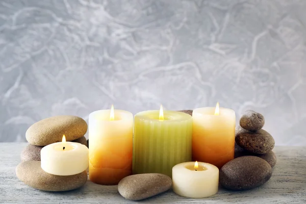 Still life with spa candles on light wallpaper background — Stock Photo, Image