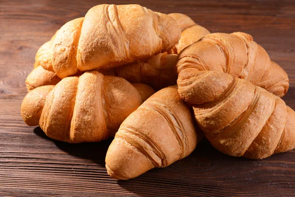 Delicious croissants on table close-up — Stock Photo, Image