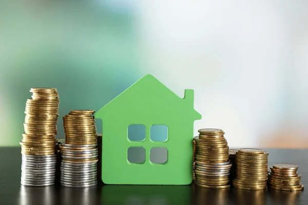 Model of house with coins — Stock Photo, Image