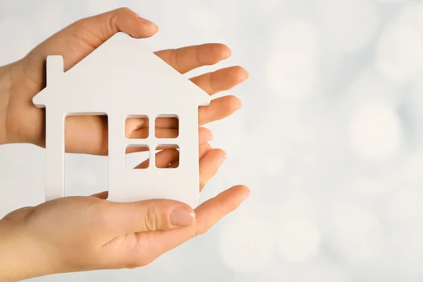 Female hands with model of house — Stock Photo, Image