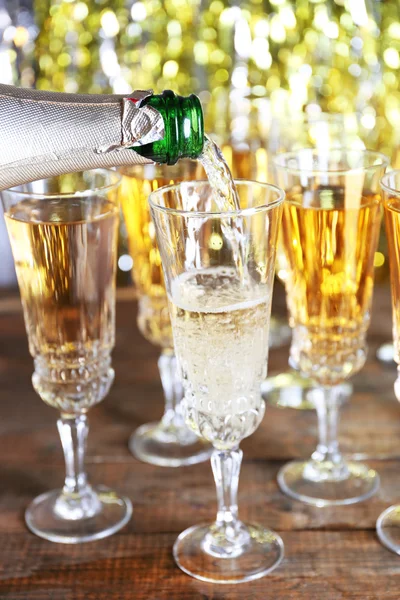 Pouring champagne from bottle — Stock Photo, Image