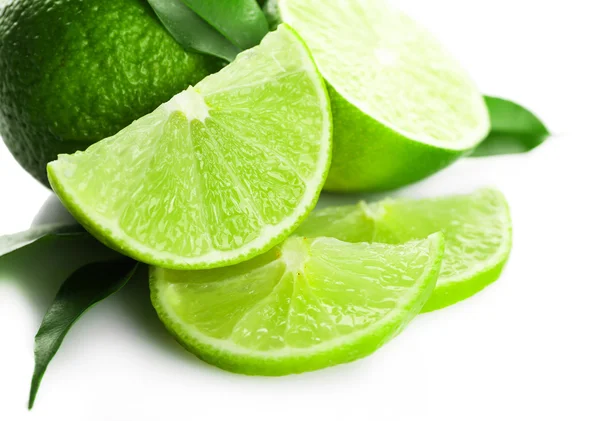 Sliced fresh limes isolated on white — Stock Photo, Image