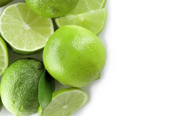 Sliced fresh limes isolated on white — Stock Photo, Image