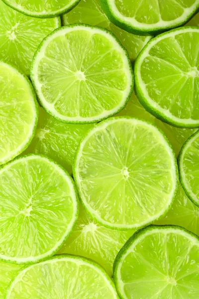 Sliced fresh limes, closeup — Stock Photo, Image