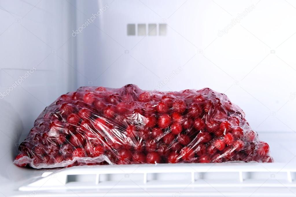 Frozen berries in bag in freezer close up