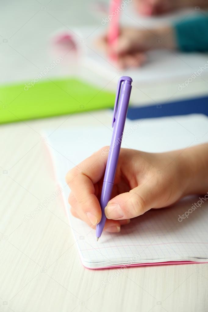 Hands of students at school, close up