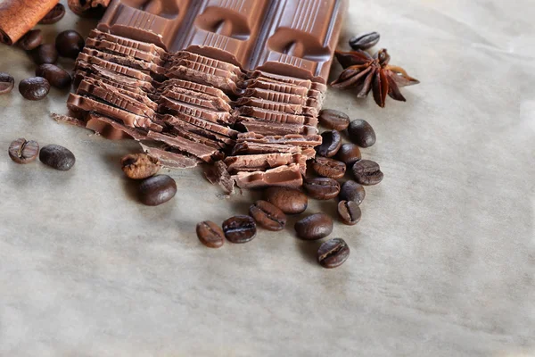 Chopped chocolate on parchment background — Stock Photo, Image