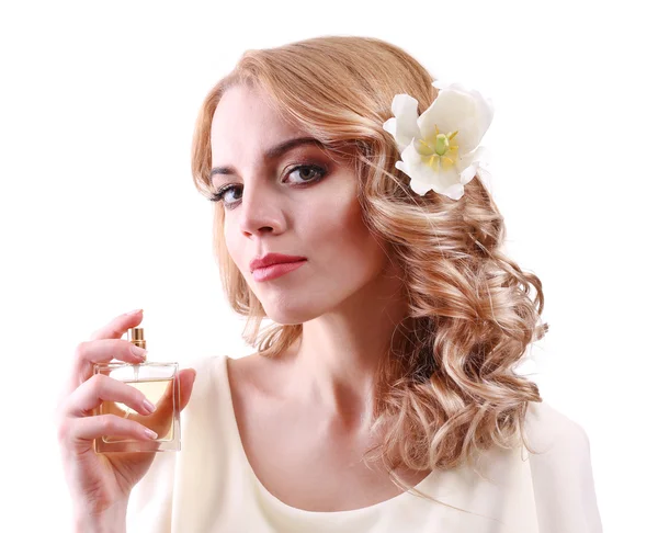 Mulher bonita com frasco de perfume isolado em branco — Fotografia de Stock