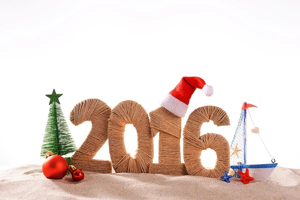 Nowy rok 2016 znak na plaży piasek — Zdjęcie stockowe