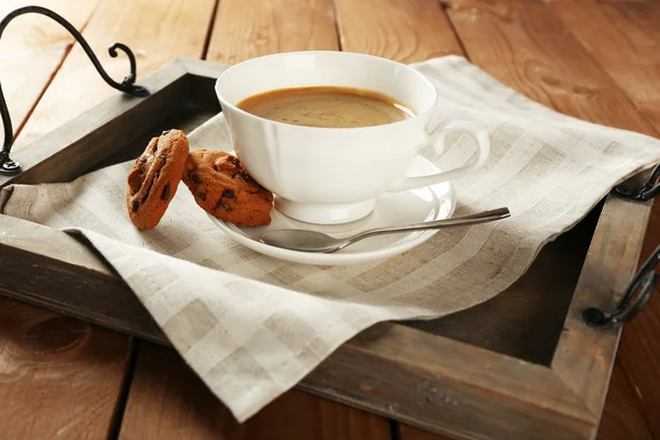 Cup of coffee with cookie on table, closeup — Stock Photo, Image