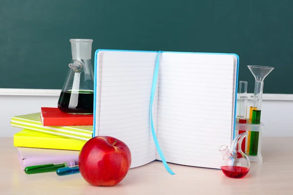 Desk in chemistry class with test tubes — Stock Photo, Image