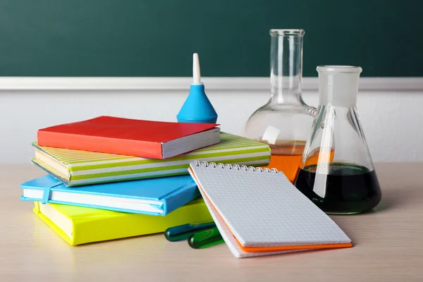 Desk in chemistry class with test tubes — Stock Photo, Image