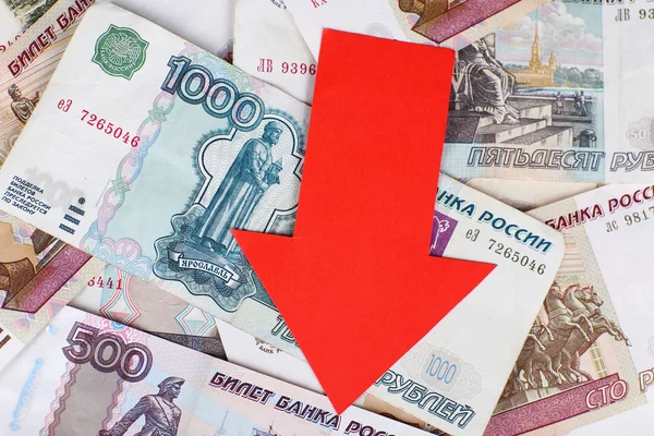 Red arrow on Russian money as depreciation of currency, closeup — Stock Photo, Image