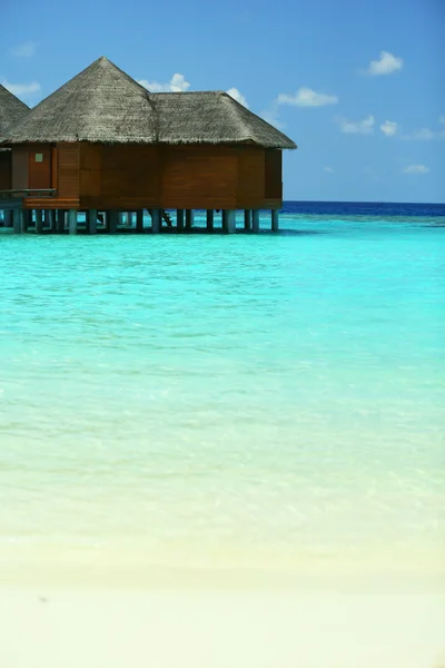 Water villas over ocean background — Stock Photo, Image