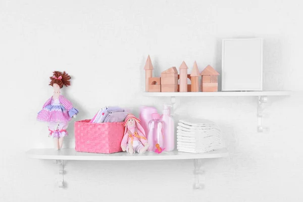 Baby accessories on shelves — Stock Photo, Image