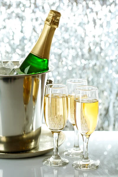 Glasses of champagne on bright background — Stock Photo, Image