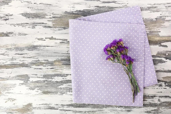 Beautiful dry flowers on napkin — Stock Photo, Image