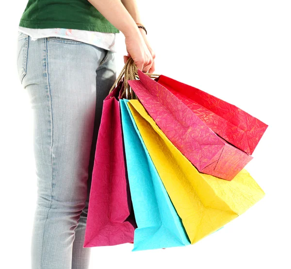 Colorful shopping paper bags in hands — Stock Photo, Image