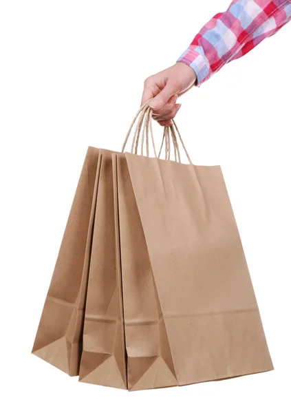 Hand holding paper shopping bags — Stock Photo, Image