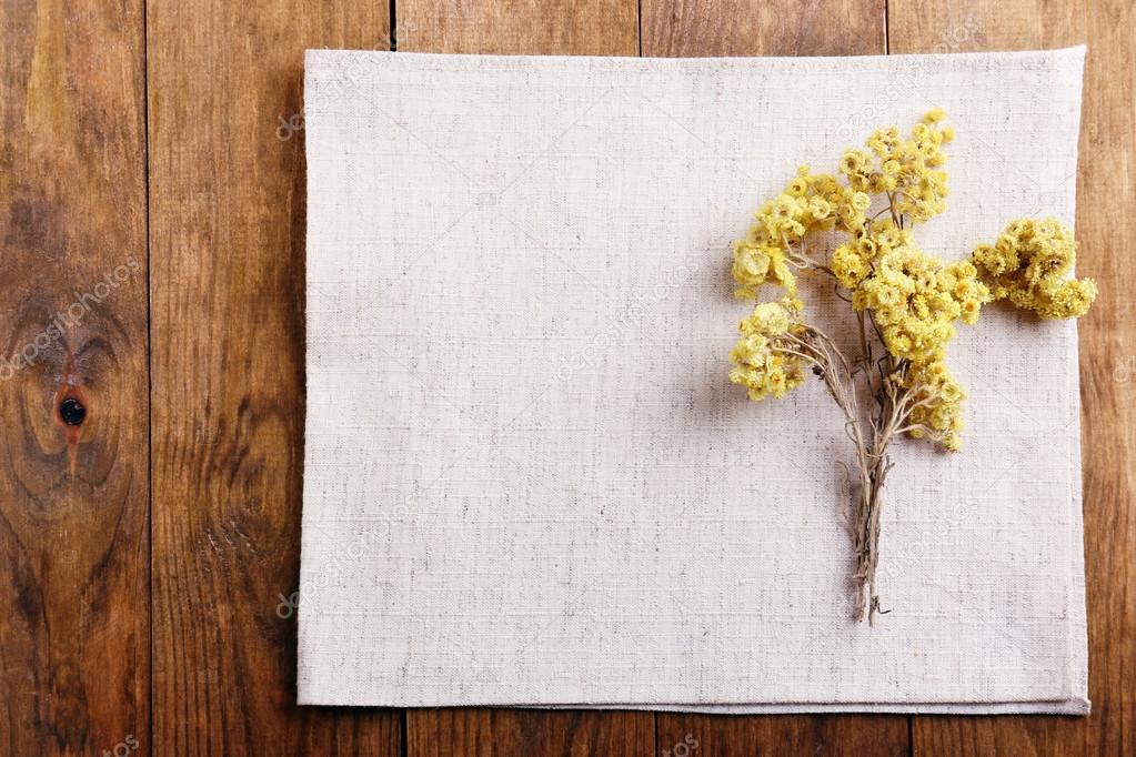 Beautiful dry flowers on napkin