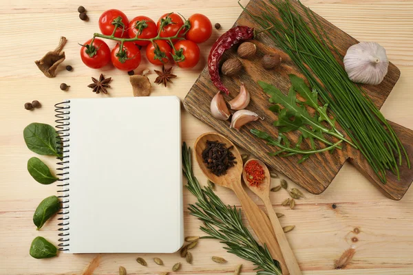 Open recipe book with fresh herbs — Stock Photo, Image