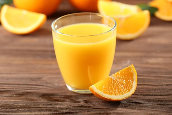 Orange juice on table — Stock Photo, Image