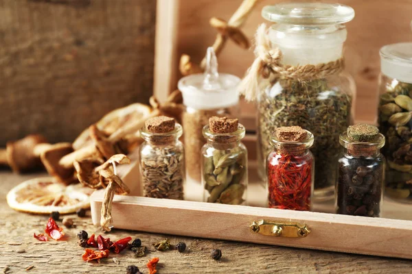 Assortment of spices in glass bottles — Stock Photo, Image