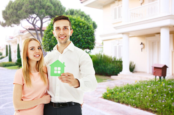 Loving couple near house