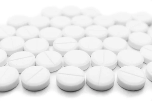 Stapel van witte pillen — Stockfoto