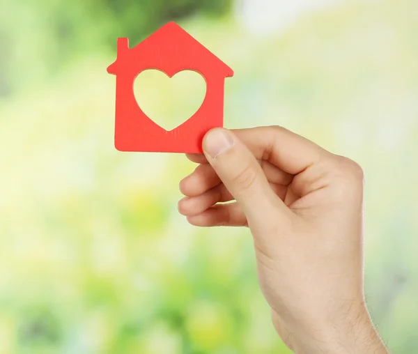 Female hand holding house — Stock Photo, Image