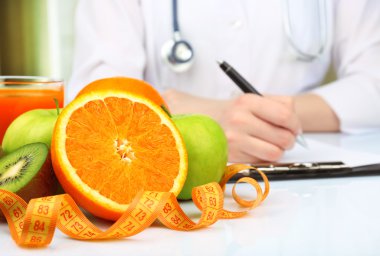 Nutritionist doctor writing  diet plan clipart