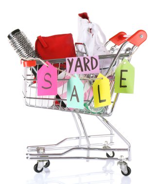 Shopping cart of unwanted stuff ready for yard sale isolated on white clipart