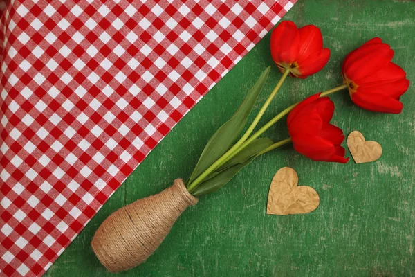 Red tulips in vase — Stock Photo, Image