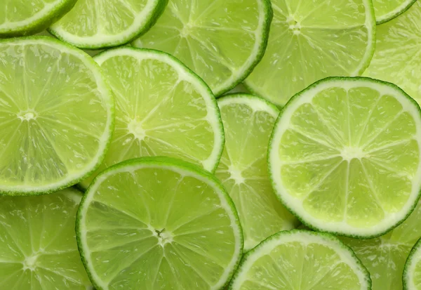 Sliced fresh limes, closeup — Stock Photo, Image